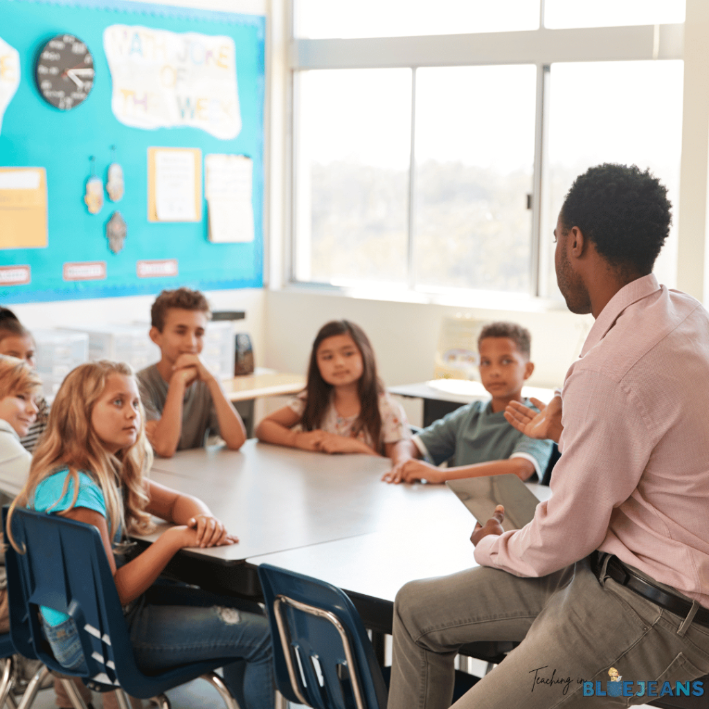 This photo shows a teacher talking to their students. Self-reflection and discussion go hand-in-hand with teaching self control.