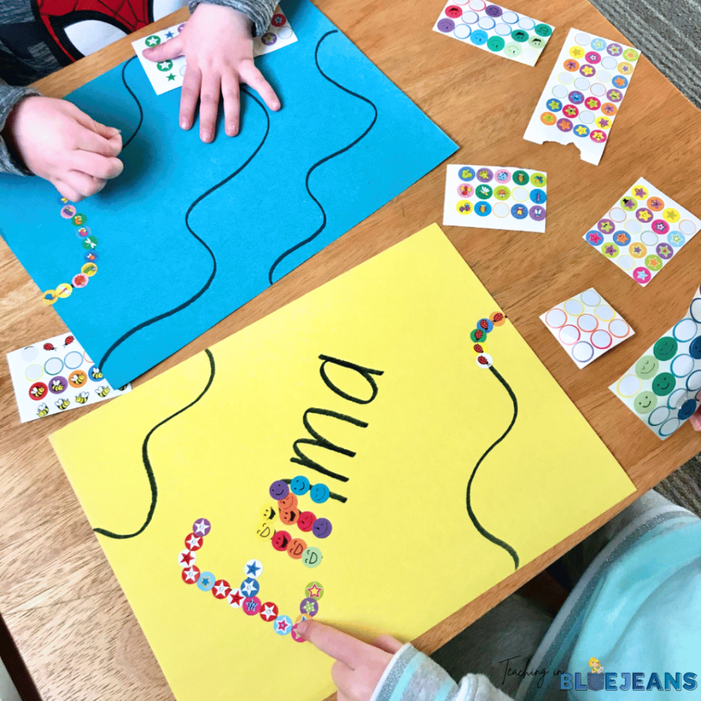 In these prewriting activities, students are using stickers to cover lines and letters in their name.