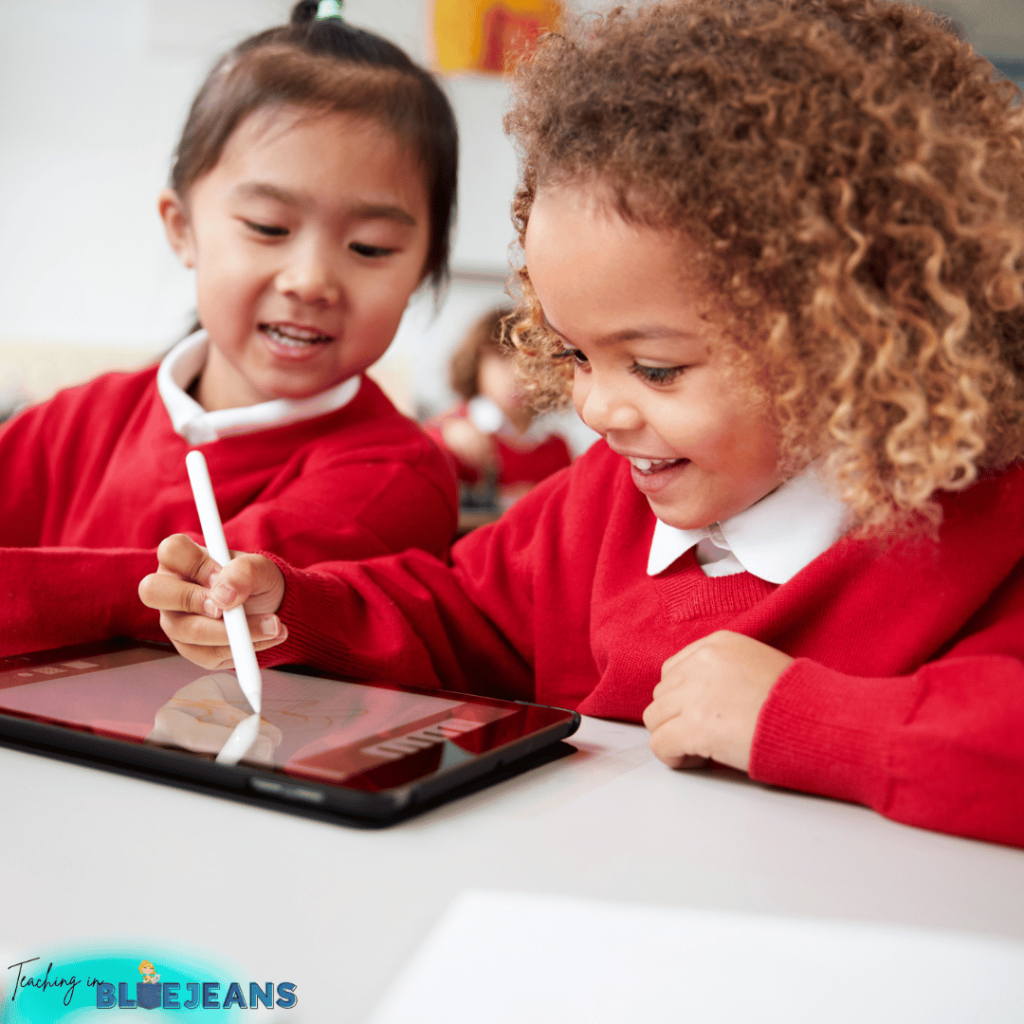 This image shows lower elementary students using a tablet in class.