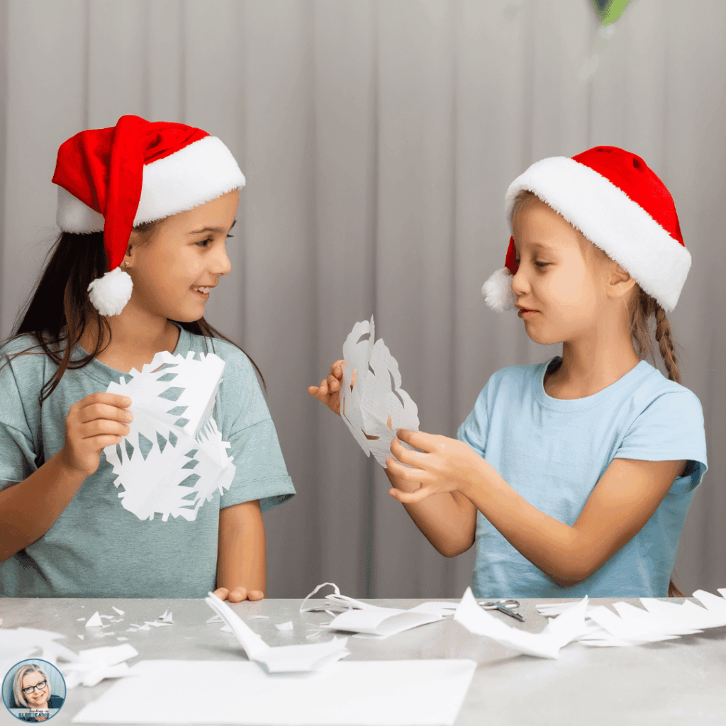 This image shows students constructing paper snowflakes.
